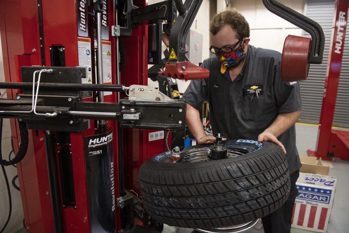 Automotive student with a tire