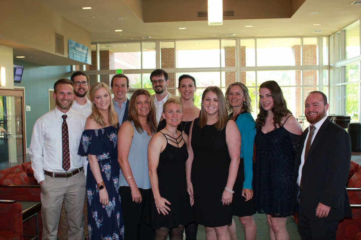 SCC physical therapist assistant program graduates pose for group picture before their pinning ceremony