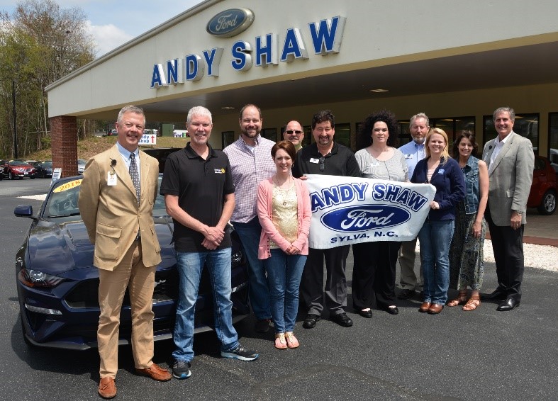 people standing at andy shaw ford