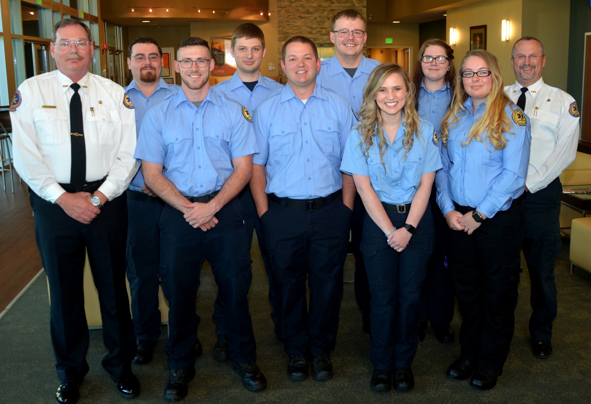 A group of students and instructors pose for a photo indoors on SCC's Jackson Campus.