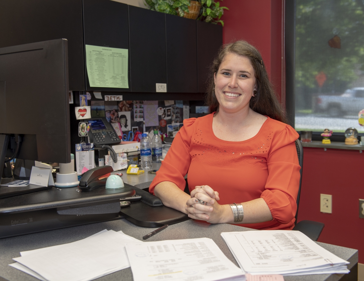 Smiling woman at her desk