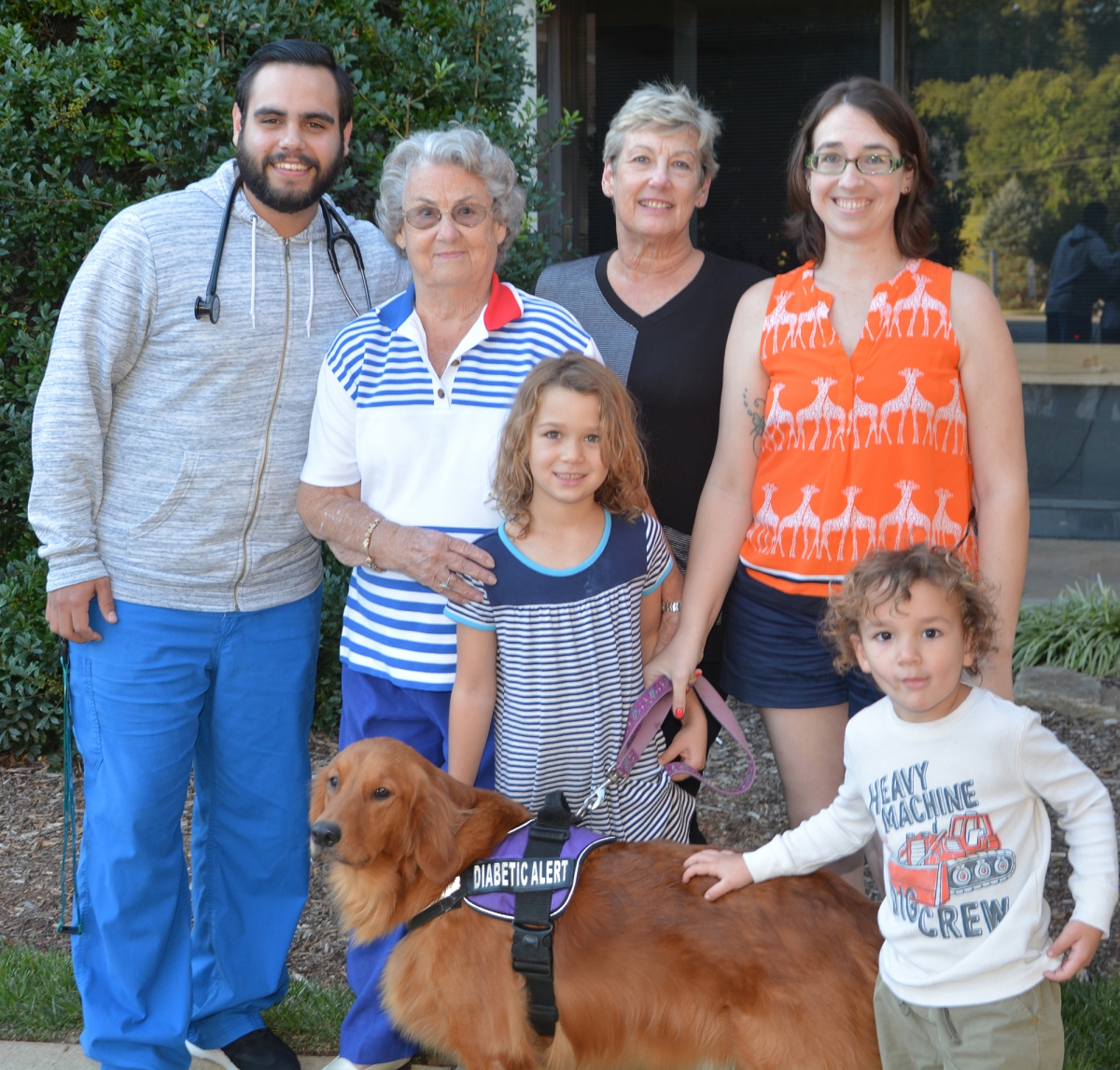 Nancy Klutz and family pictured outside with scholarship recipient Evan Cann.