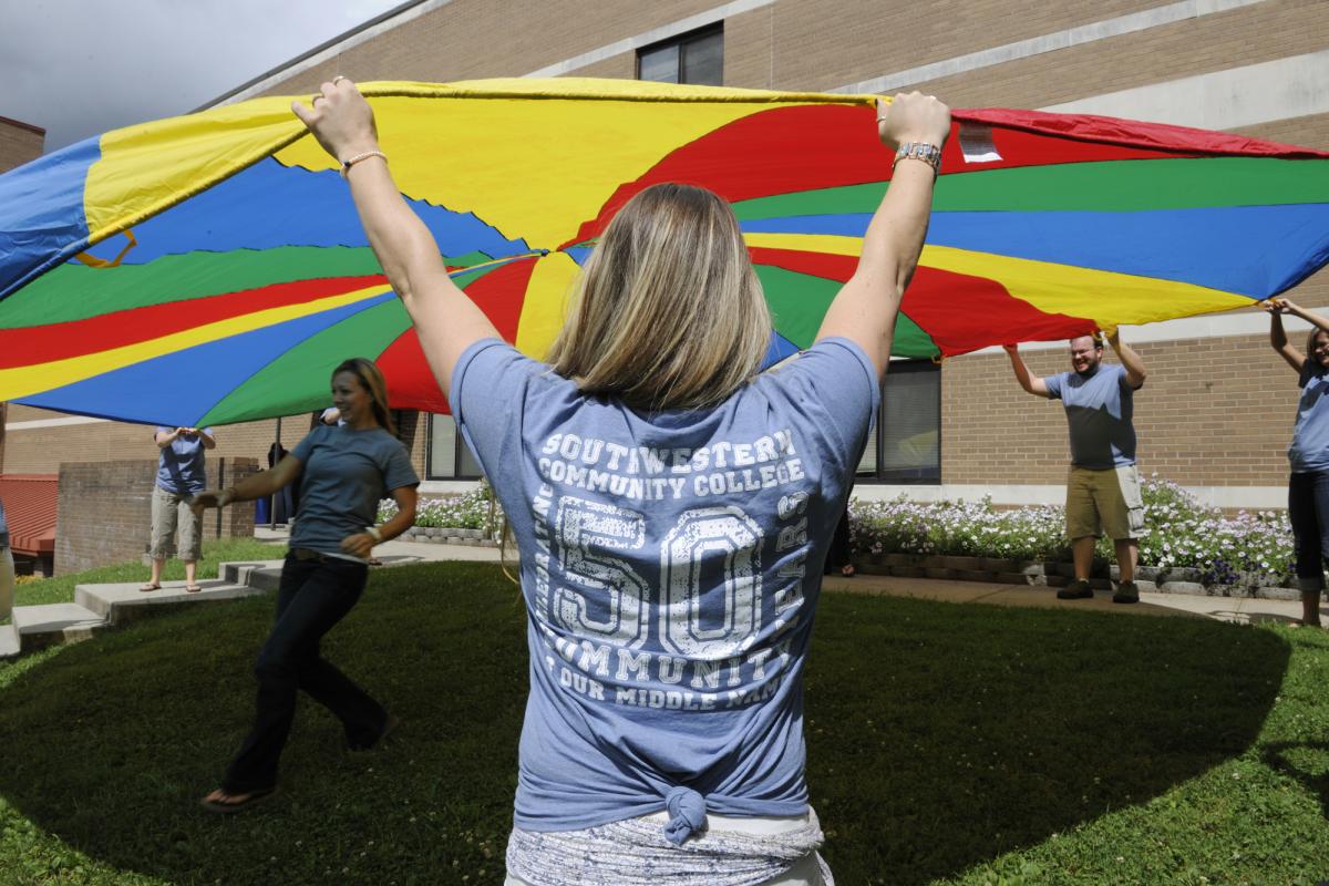 Photo of students in SCC's Occupational Therapy Assistant program participate in a recent class activity outdoors while wearing t-shirts celebrating SCC's 50th anniversary.