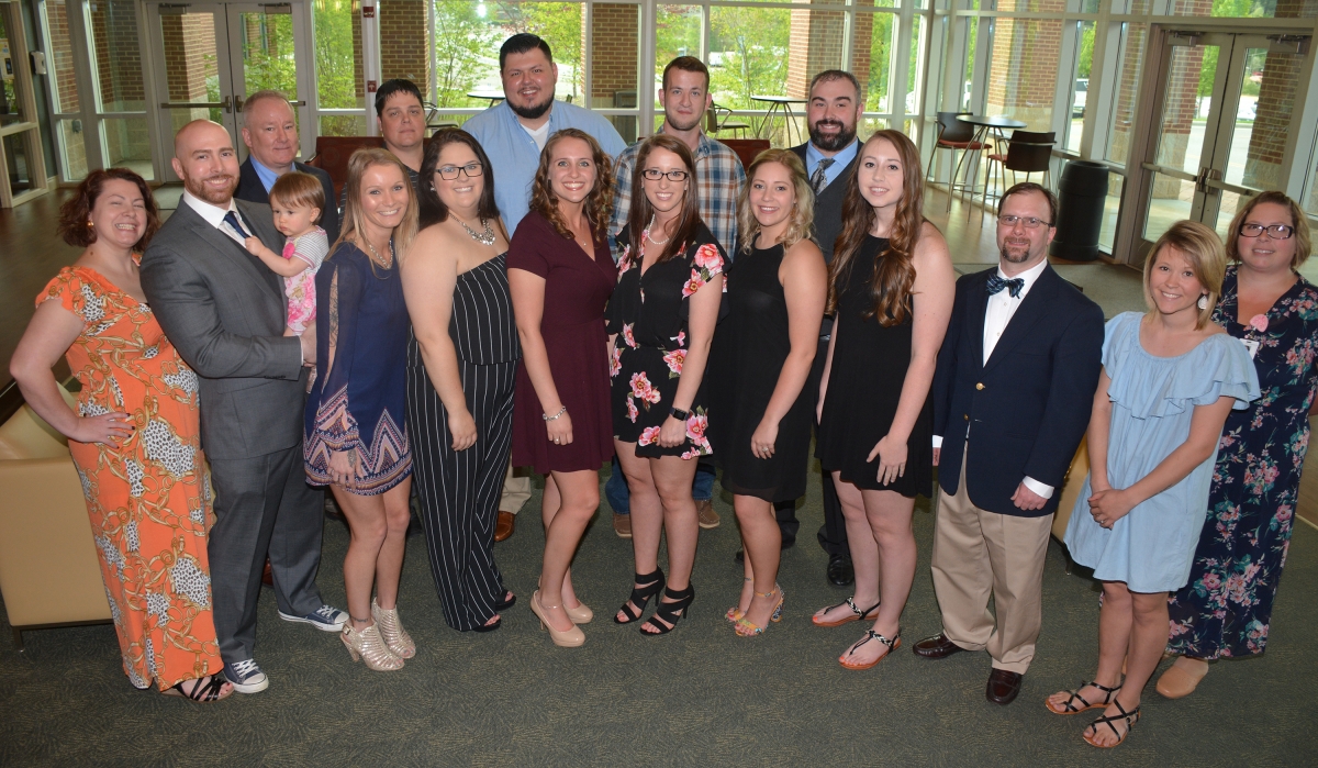 Group of people standing in a room 