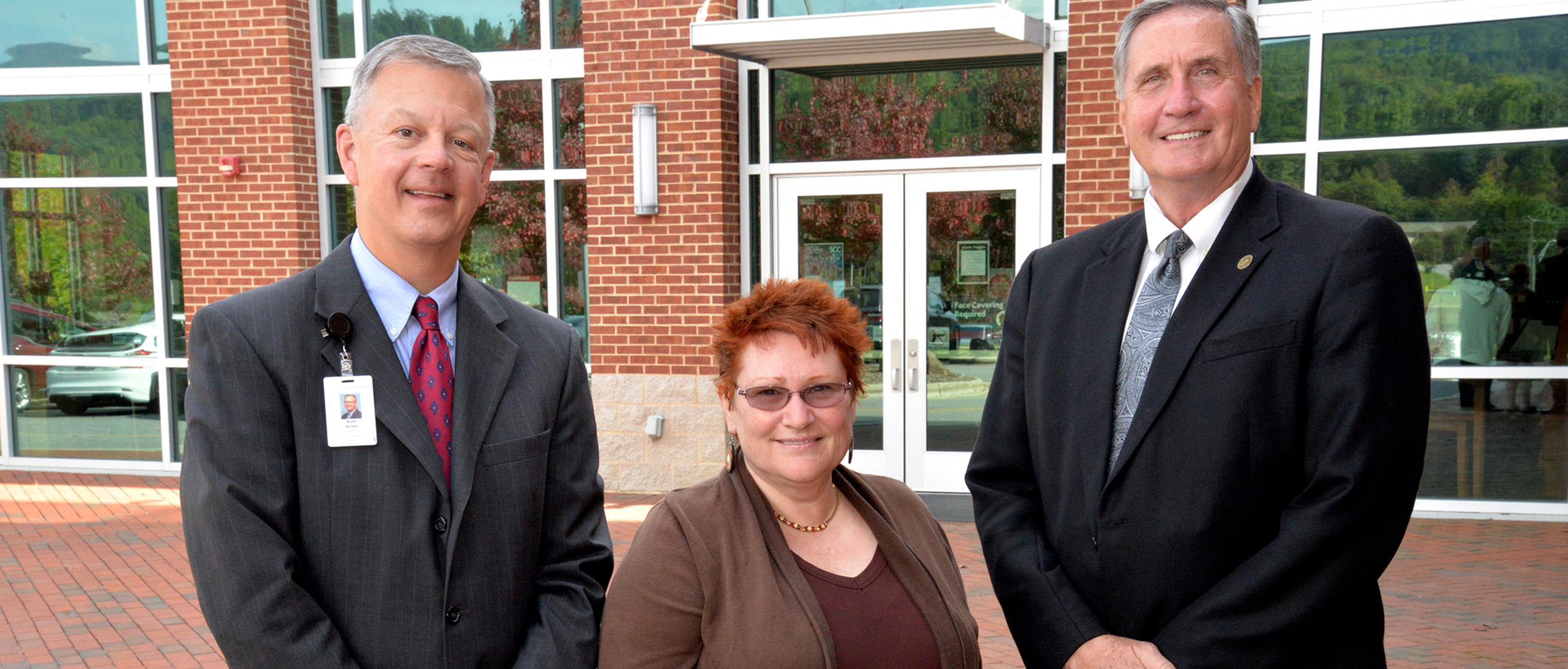 Donor poses with SCC officials