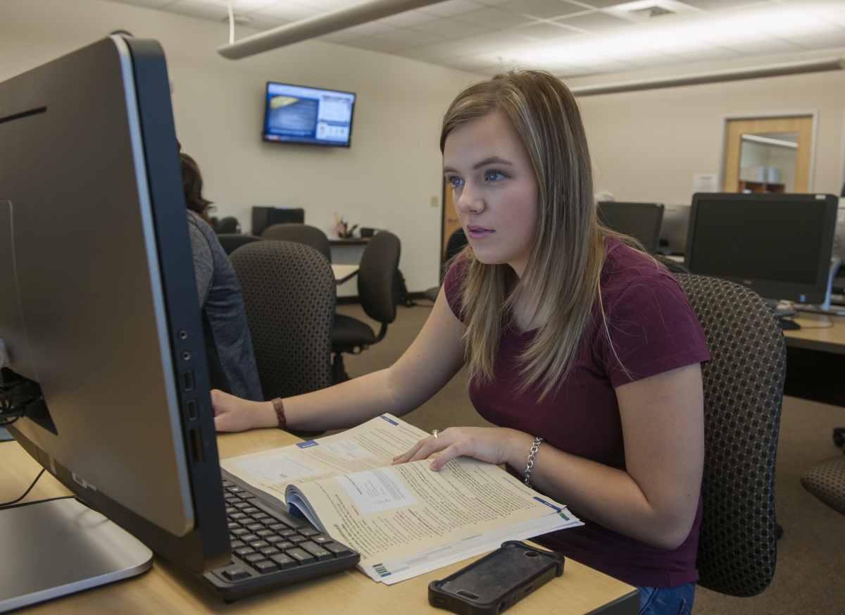 Girl at computer at Macon Campus