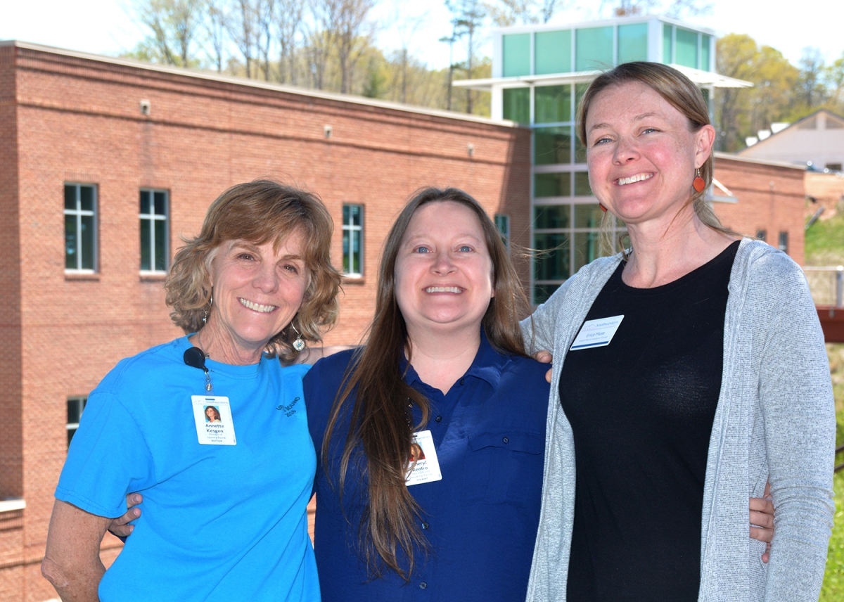 Photo of three ladies standing outdoors on SCC's Jackson Campus