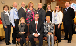 Photo of Officials from Denmark’s Social- Og Sundhedsskolen (Basic Health Care College) who recently visited Southwestern Community College included: Dr. Hanne Helleshøj, president (seated at right); Hans-Henrik Johansen, director of simulation and internationalization (standing at right); and Vicky Asmussen, director of retention, evaluation and quality assurance (seated at left). Dr. Don Tomas, SCC president, is seated in the center. Standing beside Johansen are, from left: Lynda Parlett, director of institutional development; Curtis Dowdle, dean of public safety training; Dr. Thom Brooks, executive vice president for instruction and student services; Sonja Haynes, dean of workforce innovations and economic development; Dr. Phil Weast, dean of student services; Dr. Barbara Putman, dean of arts and sciences; and Bethany Emory, dean of learning support. While attending a conference in Washington D.C., last year, representatives of a Danish college sat in on a presentation by Southwestern Community College officials.  The foreign visitors were so impressed by what they heard that they felt SCC merited a closer look.  So last week (Nov. 17-18), Dr. Hanne Helleshøj – president of Denmark’s Social- og Sundhedsskolen (Basic Health Care College) – and two other officials spent two days touring SCC’s facilities in Jackson, Macon, Swain Counties and the Qualla Boundary. The international visitors learned more about Southwestern’s programs and retention efforts.  They also participated in a number of idea-sharing sessions and expressed an interest in partnering with SCC on future endeavors, including the possibility of faculty and student exchanges.  “To say it shortly, I’m so impressed,” said Dr. Helleshøj when asked to reflect on the visit. “What I noticed was more on the professional side. They provided exquisite hospitality and food and extraordinary openness. I like cooperating with people who have a sense of humor.  “The reception when we arrived, the way everyone was lined up to welcome us, it was so in line with the values of this college,” added Dr. Helleshøj, who was joined by Hans-Henrik Johansen, director of simulation and internationalization; and Vicky Asmussen, director of retention, evaluation and quality assurance.. “I hope we continue this relationship and cooperate in areas where we can. I hope there will be an opportunity for SCC representatives to visit our college in Denmark. We hope this will evolve into a larger partnership.”  Besides visiting Harrah’s Cherokee Casino and Harris Regional Hospital, the Danish visitors toured the Jerry Sutton Public Safety Training Center in Franklin and got the opportunity to drive a “skid car” – a vehicle used to prepare public safety professionals on how to manage treacherous driving conditions.  They also took advantage of a rare chance to handle a Glock handgun in SCC’s “Use of Force Simulator.” Firearms are illegal in Denmark.  “I had never fired a weapon before,” Dr. Helleshøj said with a grin. “I think I could be quite good at it with some practice.”  The original SCC presentation Dr. Helleshøj attended in Washington covered SCC’s approach to student retention.  That’s when she met Dr. Don Tomas, SCC’s president, along with Dr. Thom Brooks, now executive vice president for instruction and student services, and Cheryl Contino-Conner, executive director of student success.  Along with their stop in Western North Carolina, the Danish contingent also made stops at colleges near Orlando, Fla., (Seminole State) and Buffalo, N.Y. (Genesee Community College).  