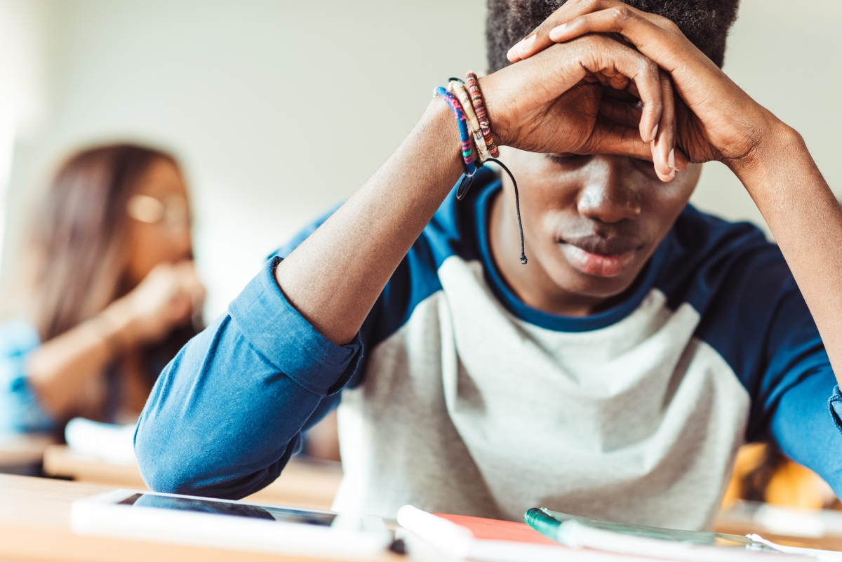 Stressed Student with head in hands