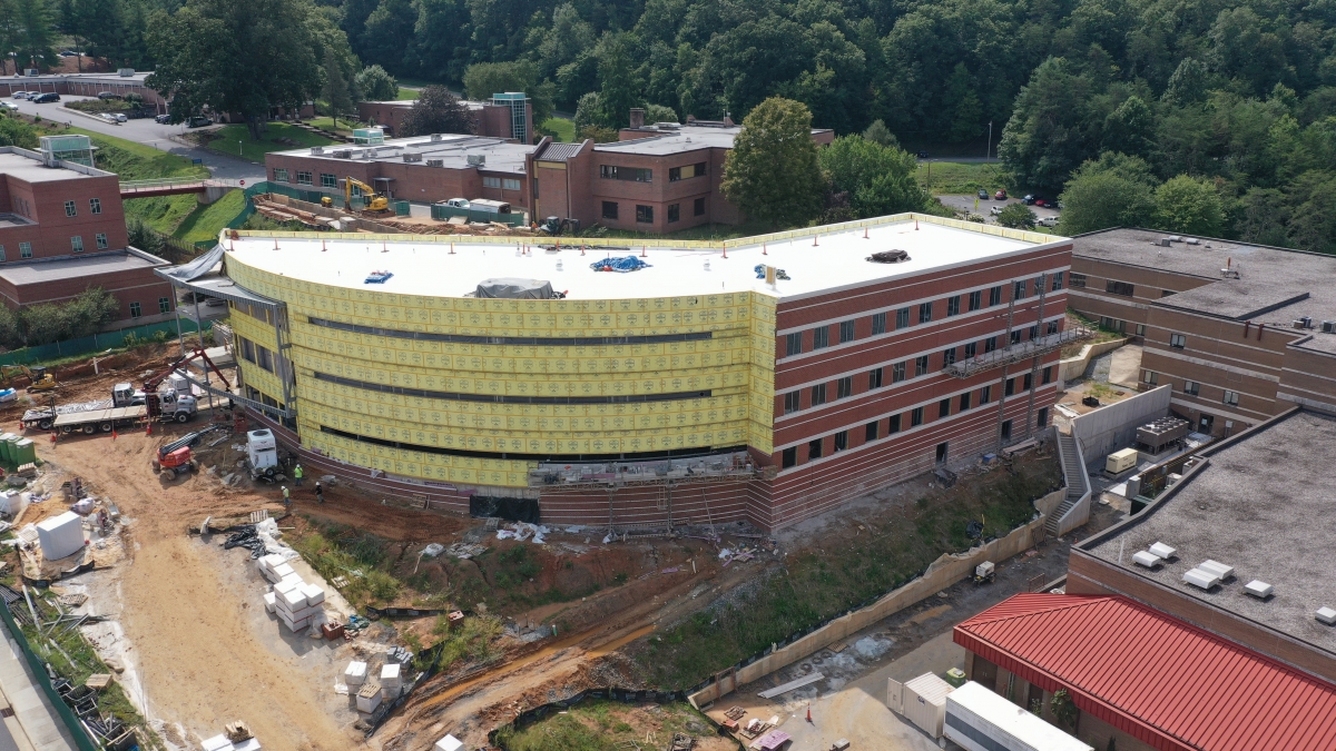 A large brick building is being constructed