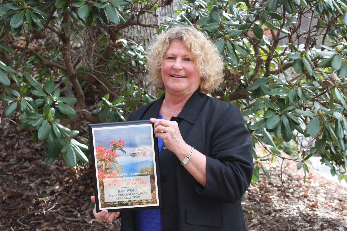 Kay Wolf with award she and the English Language Learners received.