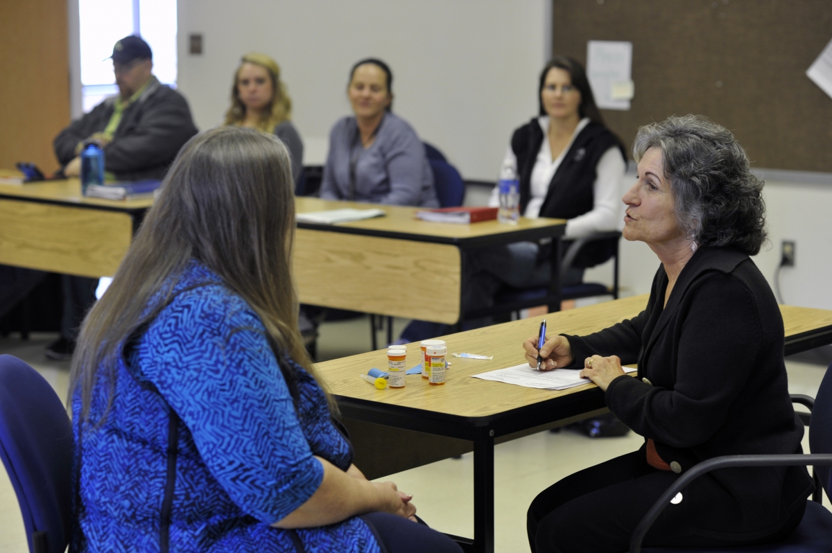 Photo of Sarah Altman in classroom with students