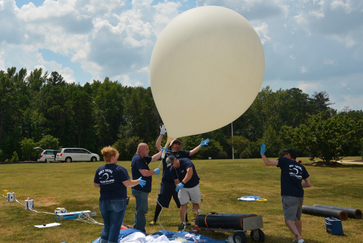 Image of SCC's high-altitude weather balloon team with the balloon right before launching.