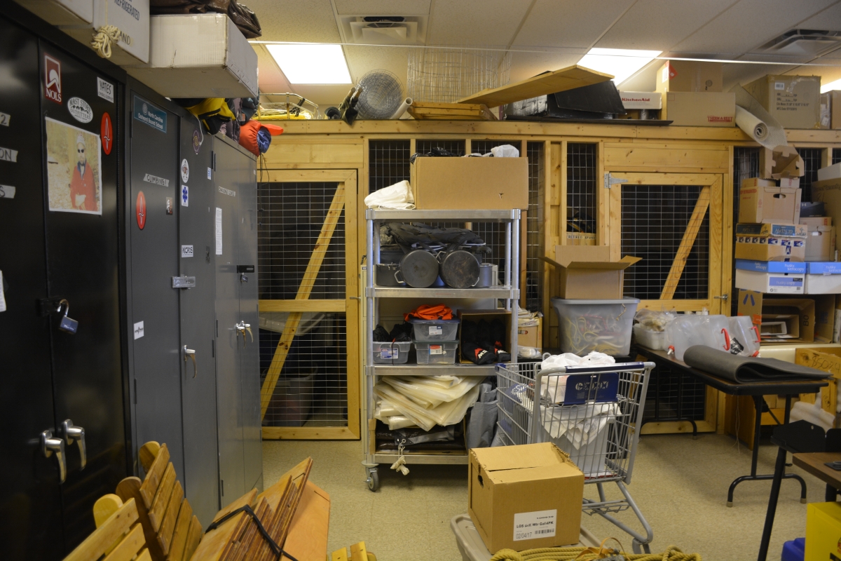 Supplies sit on and around shelves and cabinets.