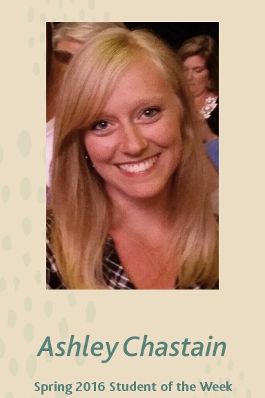 Ashley Chastain smiling. She's wearing a black and white black plaid shirt