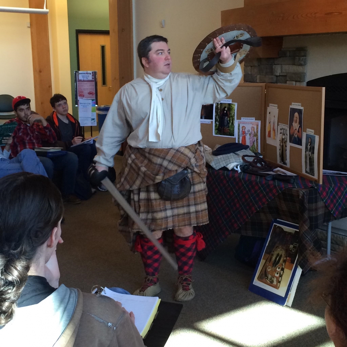 Museum curator presenting Scottish dress