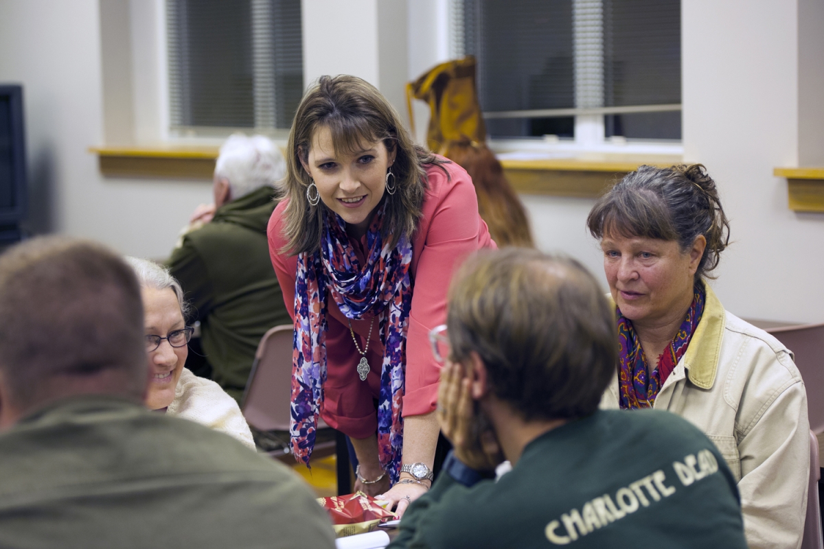 Tiffany Henry speaks with participants in a recent seminar