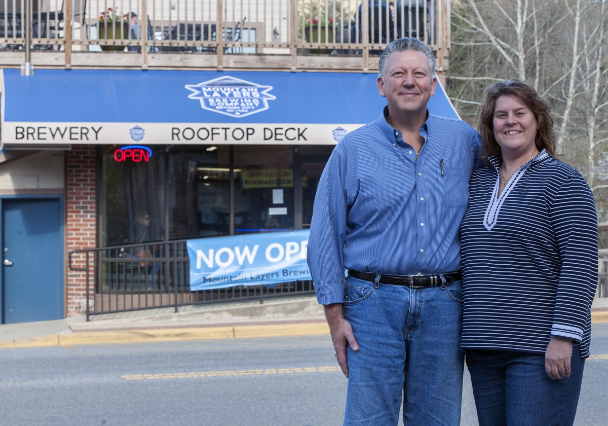 Photo of a couple standing outside a bar in Bryson City. 