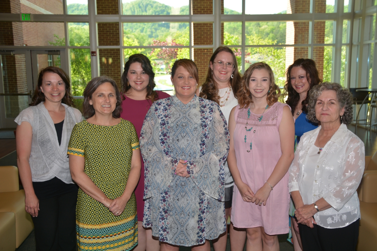 A group of students, flanked by their instructors, are shown here in a photograph taken inside the Burrell Building on SCC's Jackson Campus.