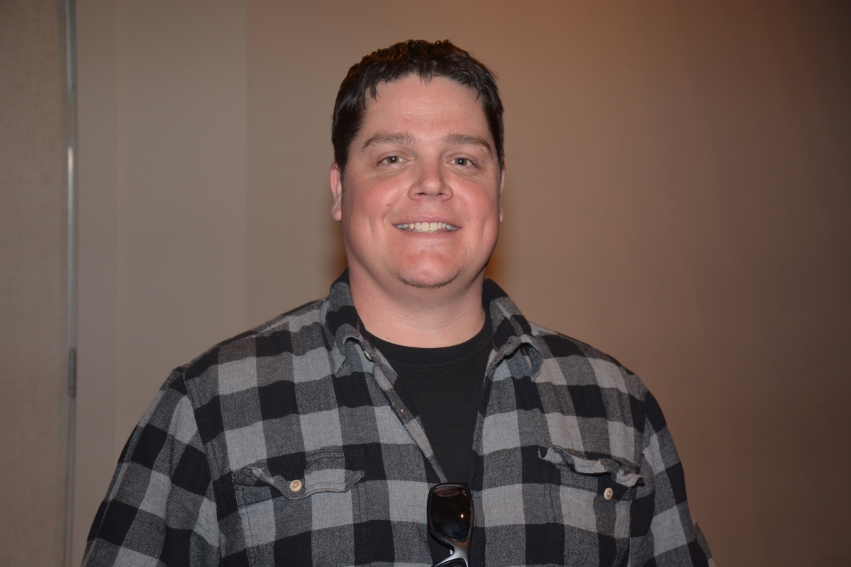 Man smiles at camera