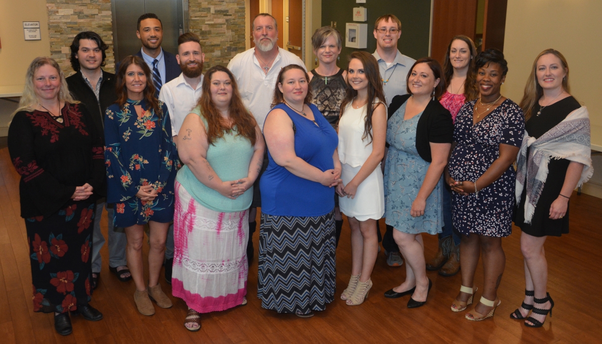 A group of students and instructors poses inside a building on SCC's Jackson Campus.