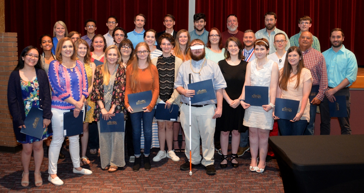 A large group of students pose for a photo