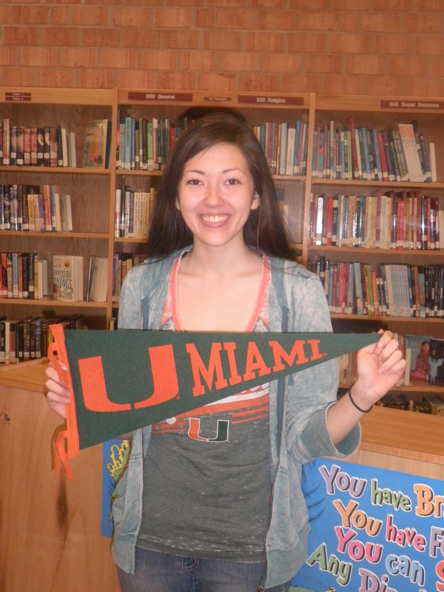 Whitt holding U of Miami flag