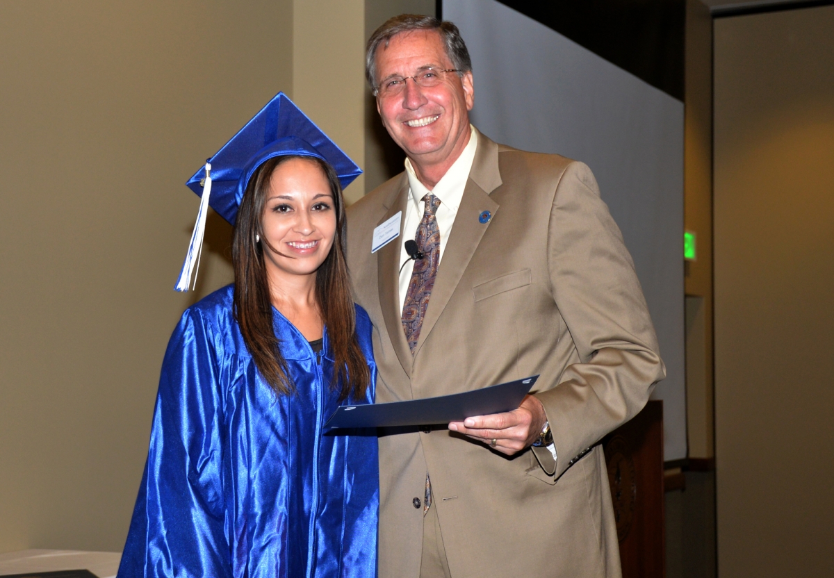 Student and president smiling