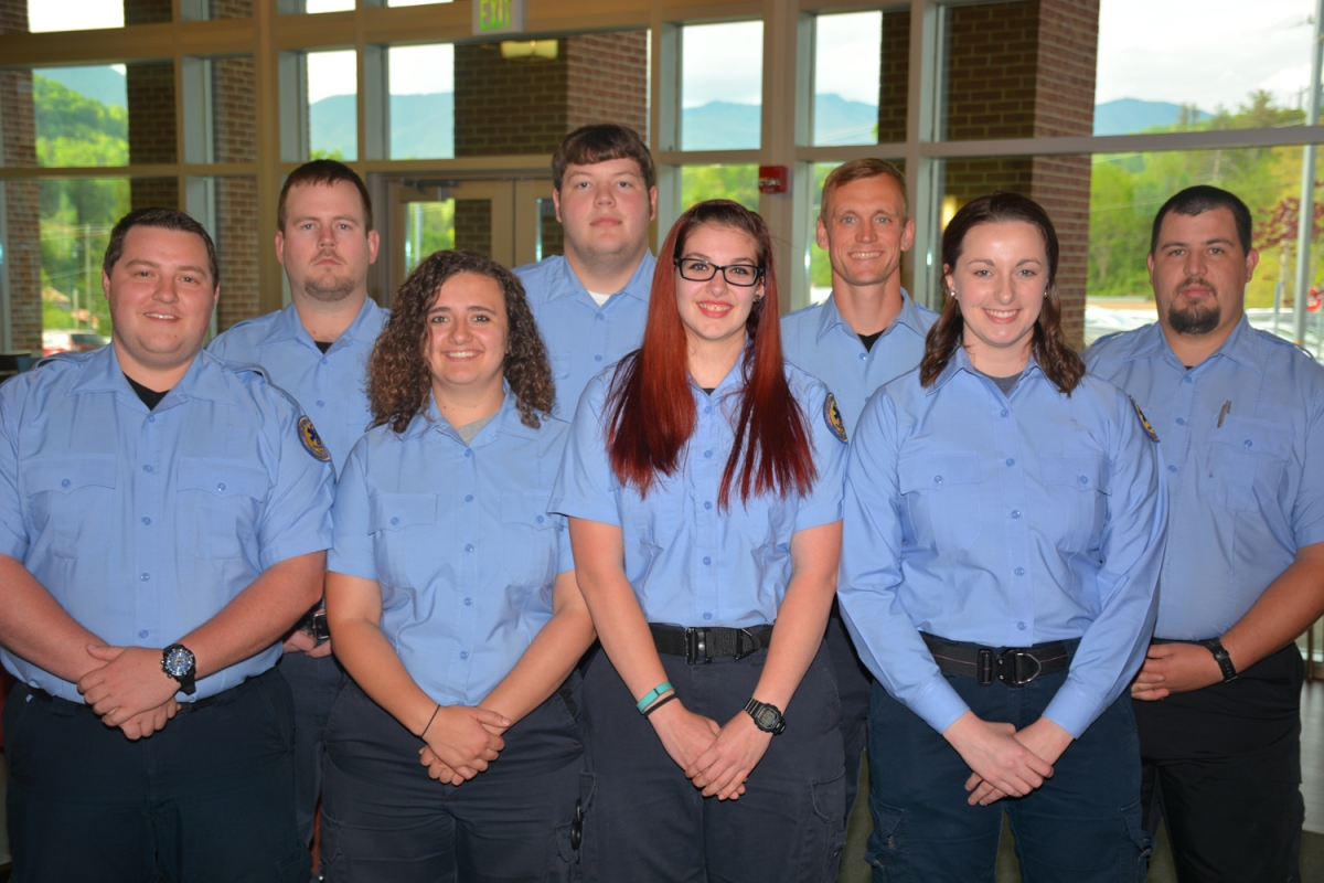 EMS students standing and smiling 