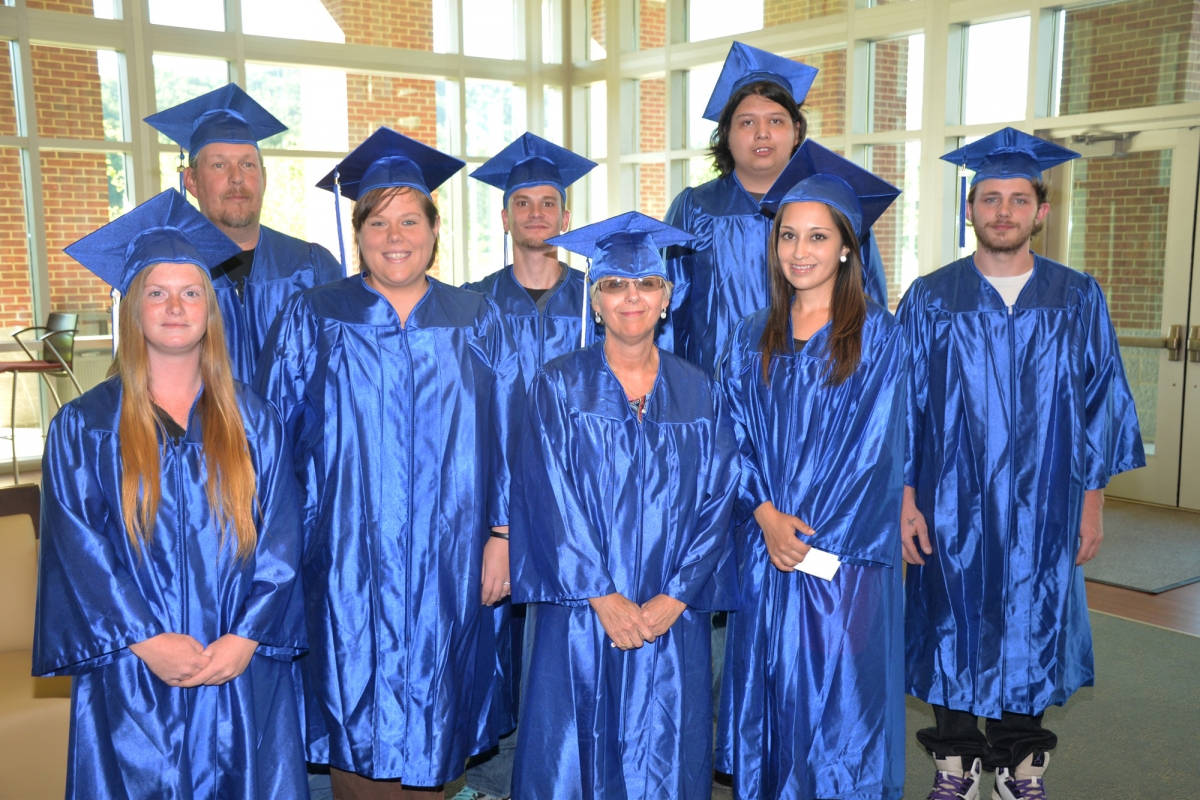 Students standing and smiling