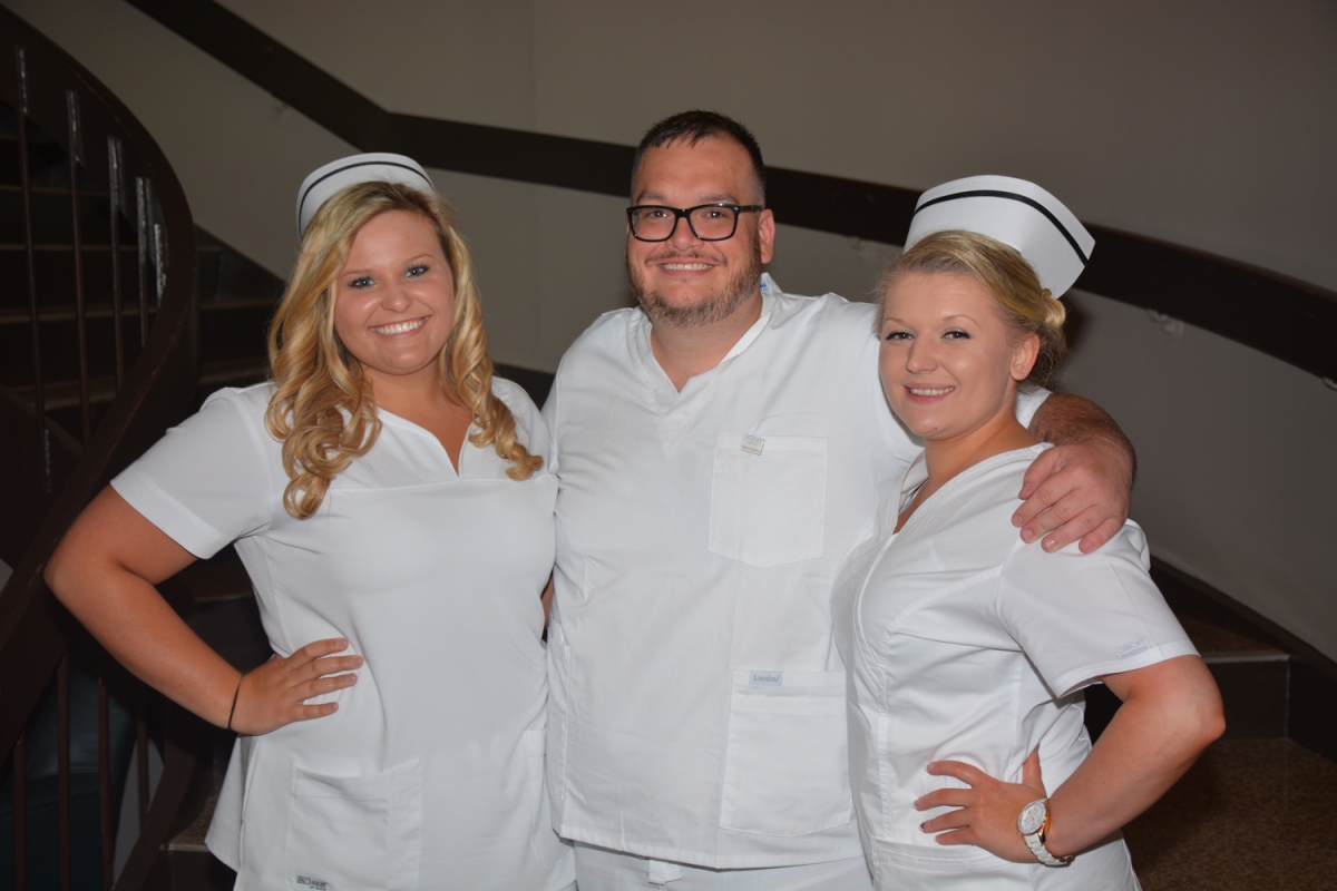 Students standing and smiling