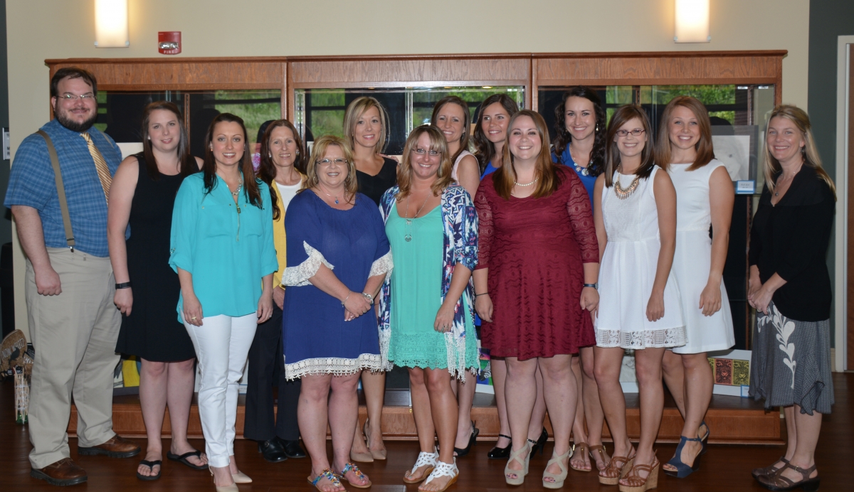 Students standing and smiling