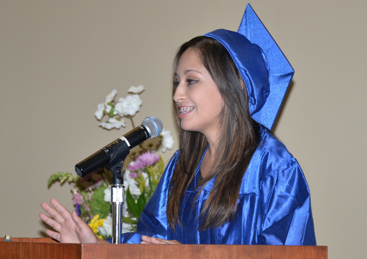 Student speaking into microphone