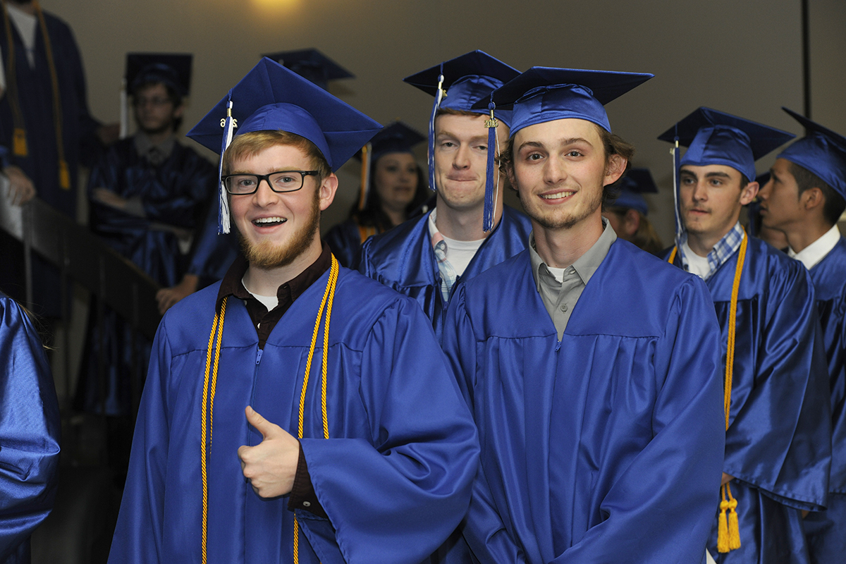 Photo of graduates waiting to enter auditorium.