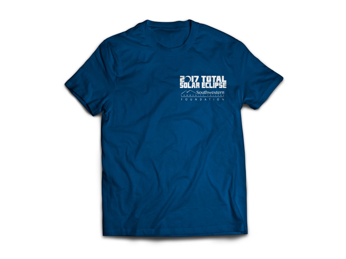 Photo of blue SCC Eclipse t-shirt with white text and graphics