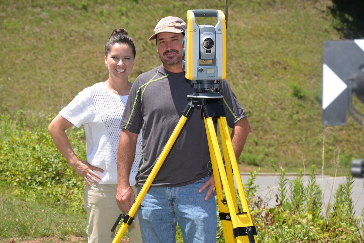 Photo of two SCC instructors with surveying equipment