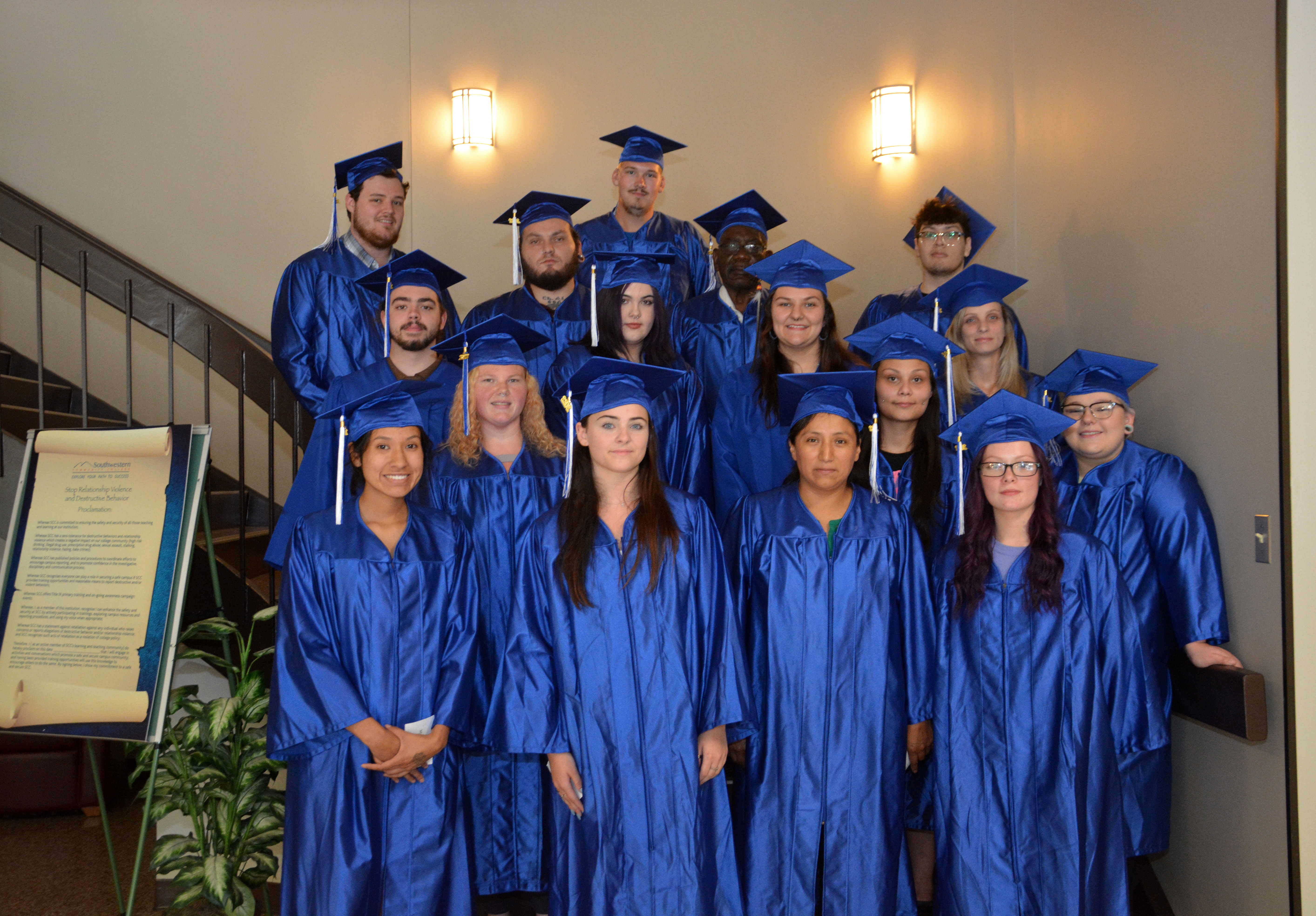 Group of students wearing graduation caps and gowns