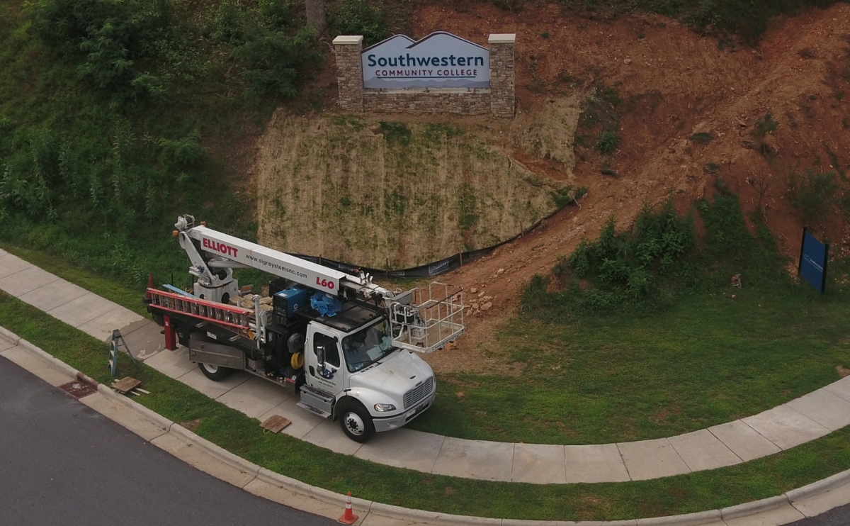 A new sign is pictured on the side of a hill on the Jackson Campus.