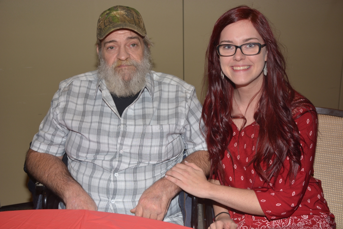 Woman and man sit inside a building on SCC's Jackson Campus.