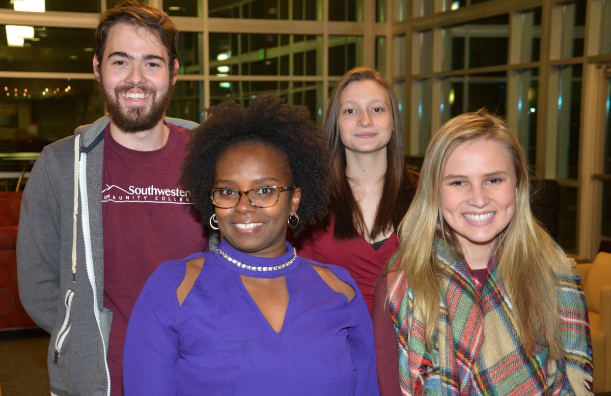 Four students pose for a photo inside a building on SCC's Jackson Campus