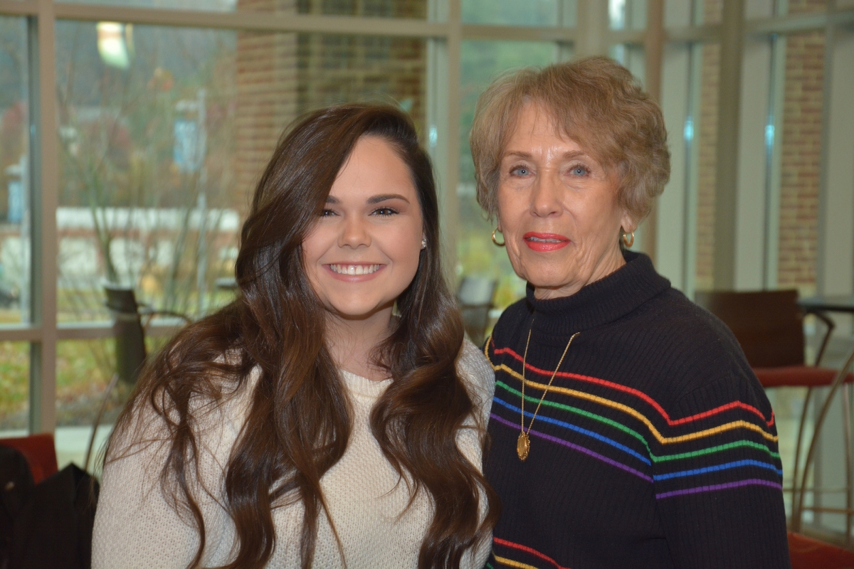 Two ladies pose for a photo inside SCC's Burrell Building in Sylva.