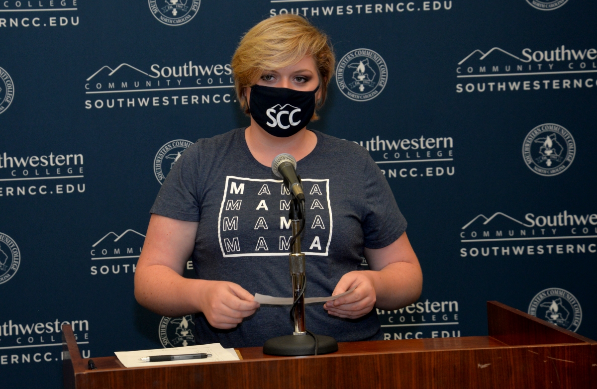 female student stands at the podium