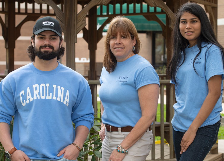 SCC's first two C-STEP graduates stand beside their advisor