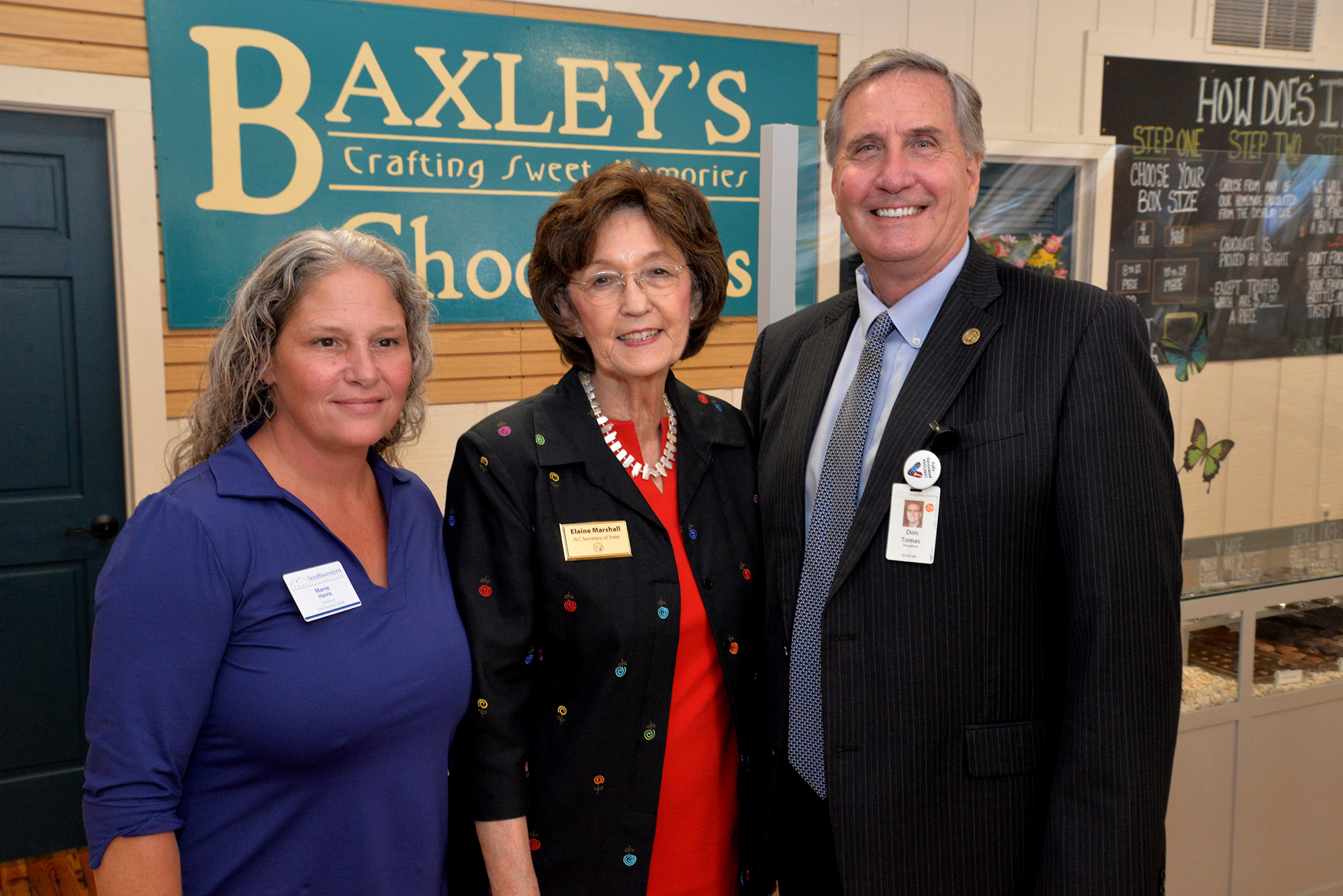 Secretary of state poses for photo with SCC's president and Director of Small Business Center