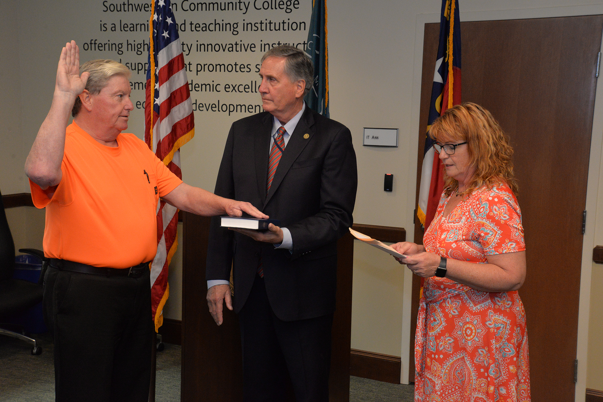 Mark Jones is sworn in by a court official