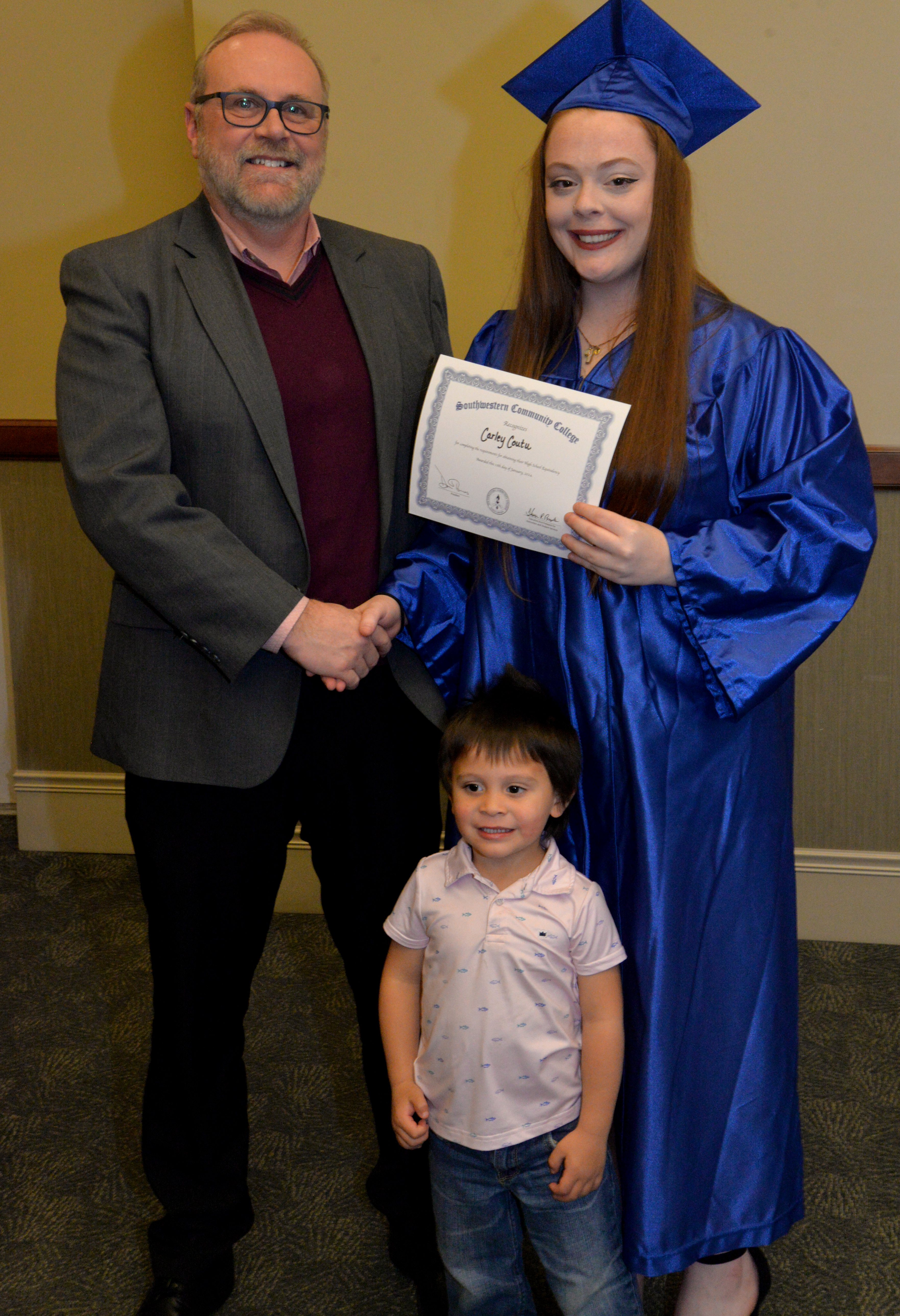 student receives diploma