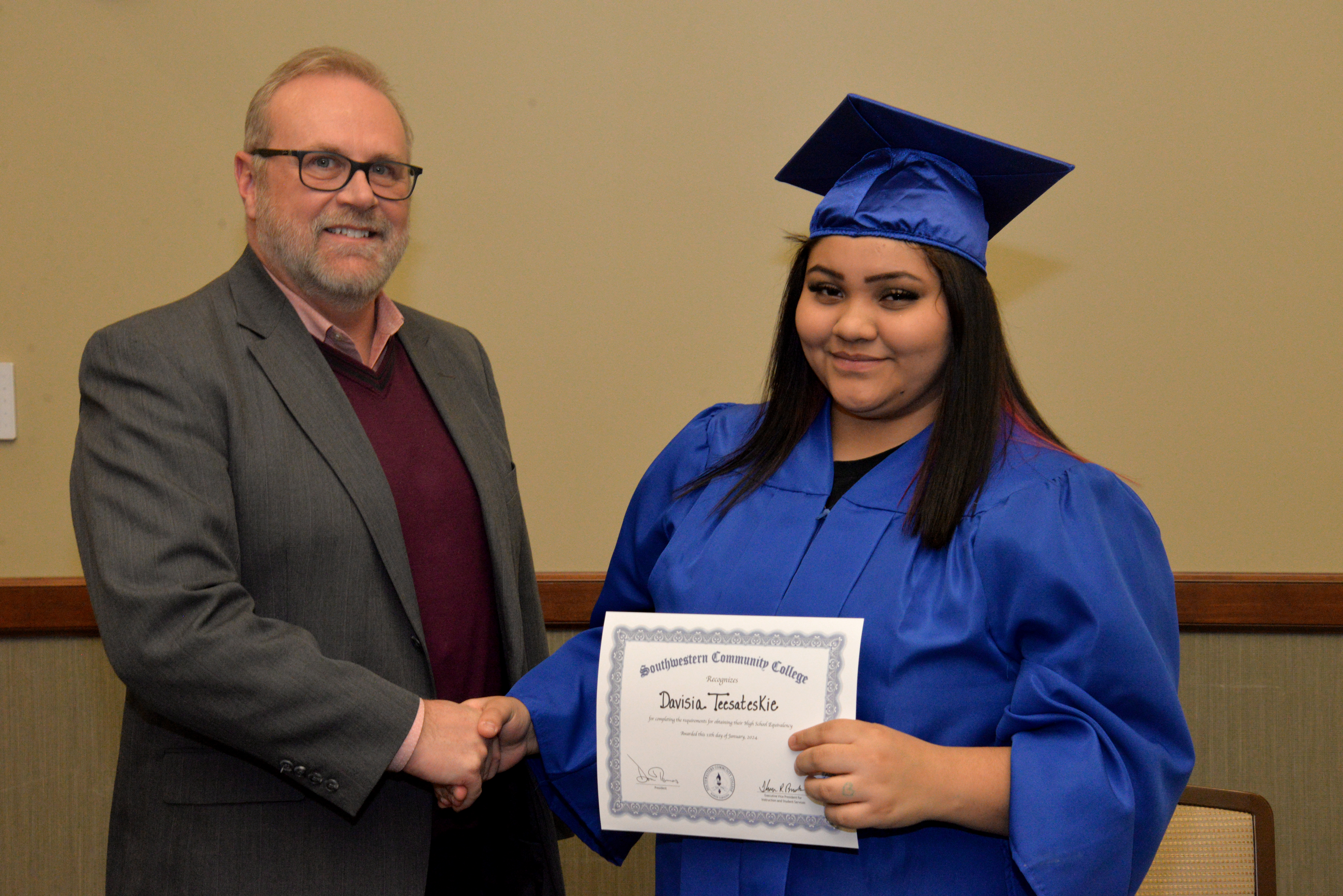 student receives diploma