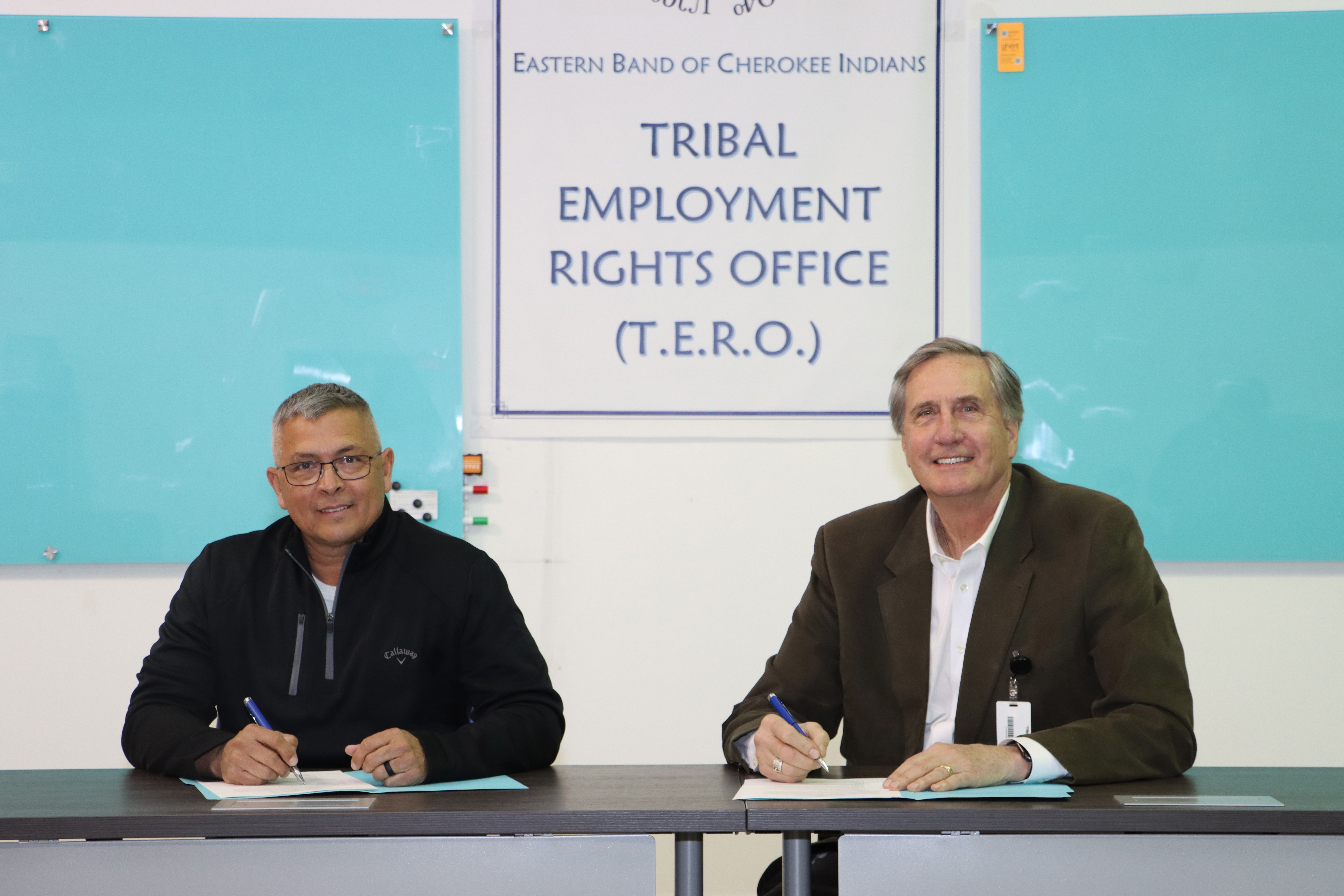 Michell Hicks (left), Principal Chief of the Eastern Band of Cherokee Indians, and Dr. Don Tomas, President of SCC, sign a Memorandum of Understanding on March 18 in Cherokee.