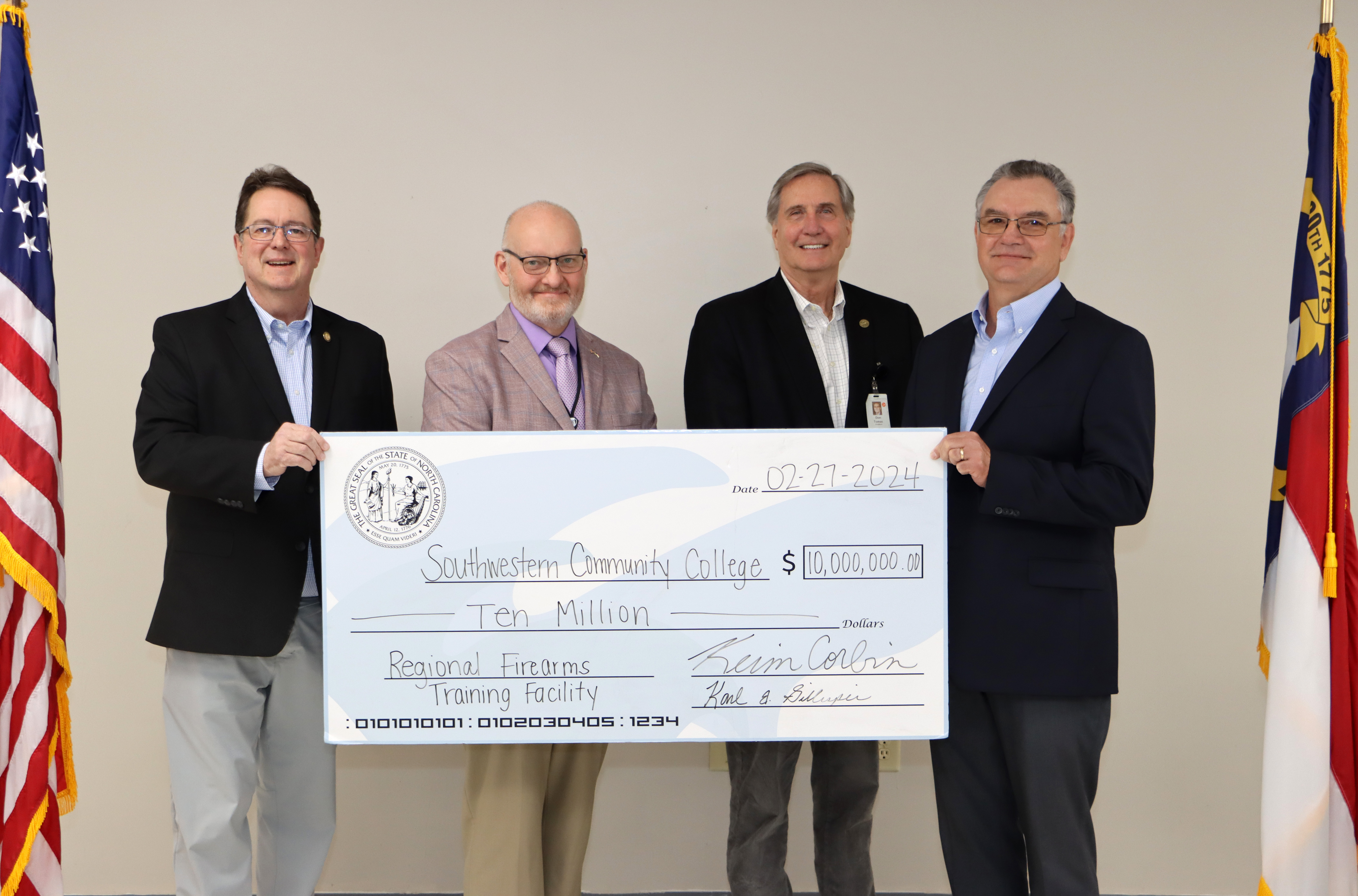 Men hold large check