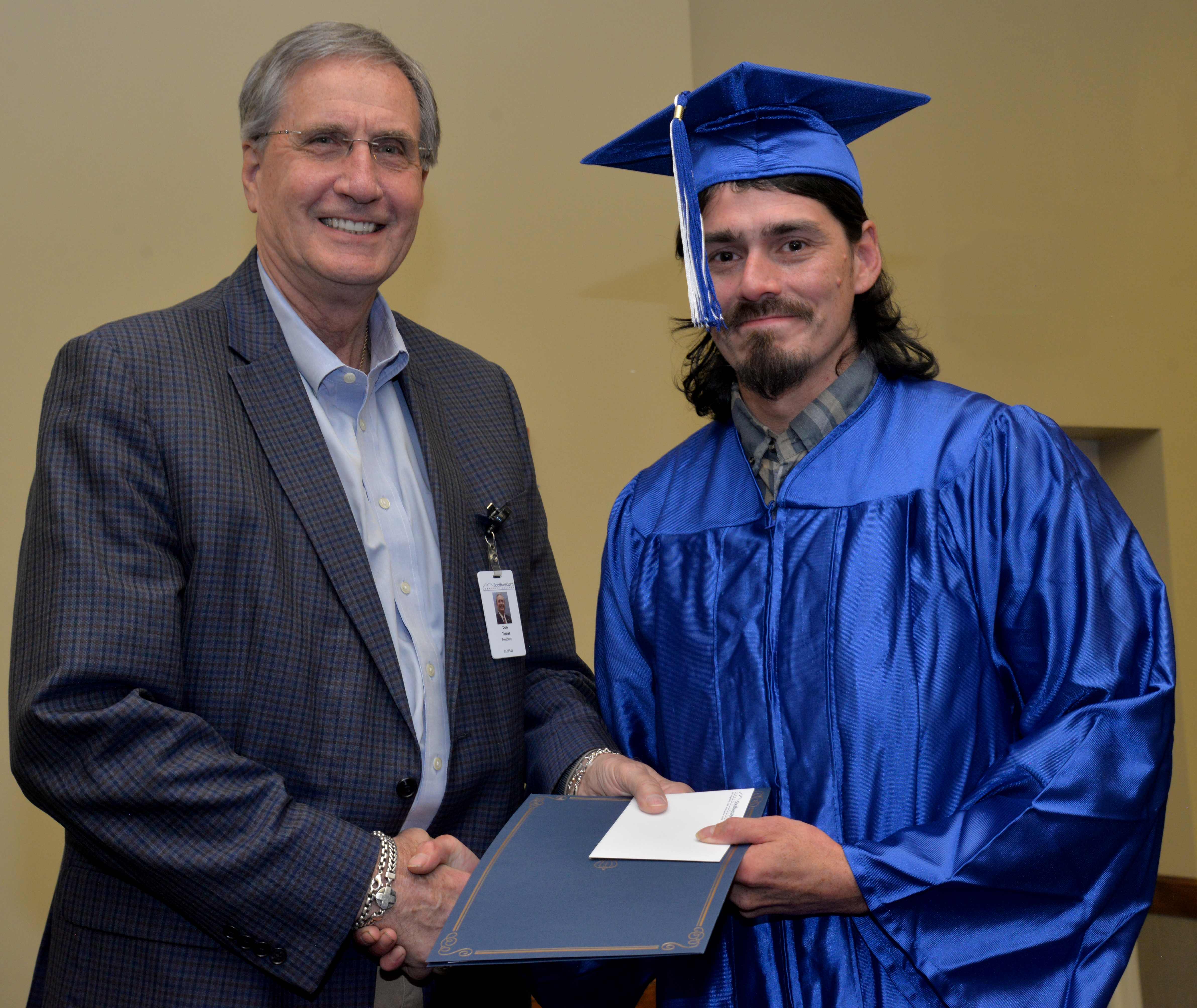 Graduate receives diploma from SCC President